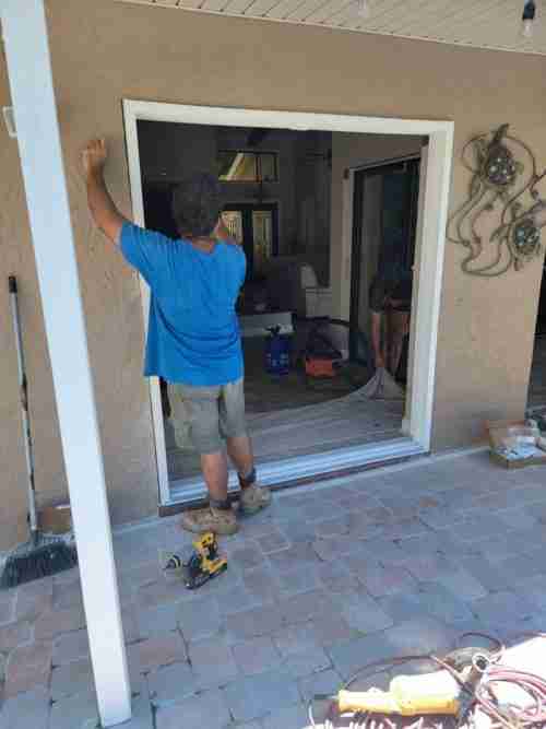 sliding glass door experts taking measurements